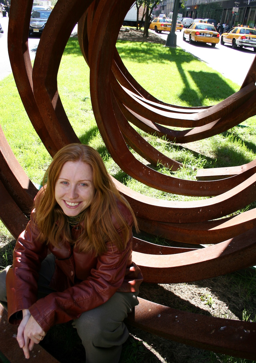Renée Favand-See sitting on a sculpture in the middle of Park Avenue, NYC